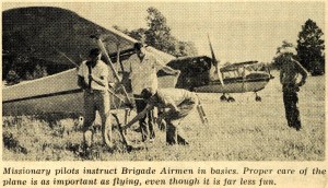 A February 3, 1964 Brigade photo showing members learning aircraft mechanics. Other Brigade activities included rifle practice and camping (Standard) - Bethel University Digital Library